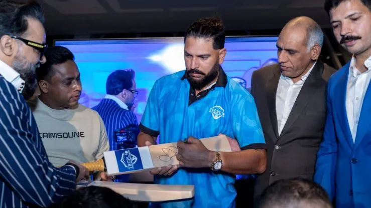 Yuvraj Singh signs a bat to launch the inaugural Tennis Ball Cricket Premier League 10 (TBCPL) at the kickoff event in Dubai on Monday, Jan 6 with promoter Naresh Pawar and key stakeholder Mohit J