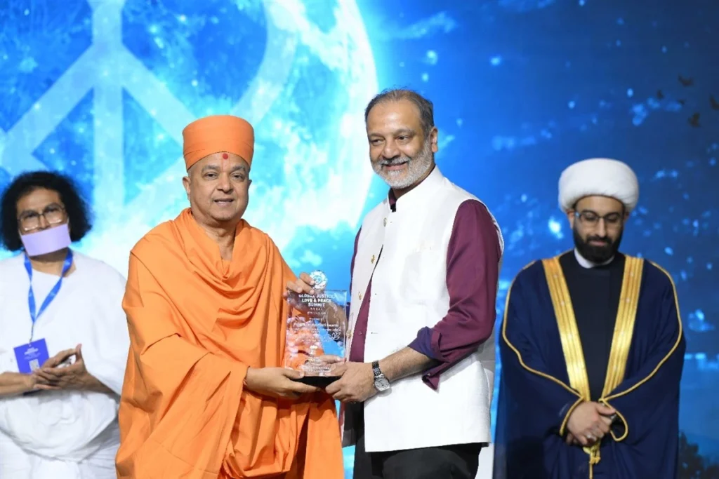 Huzaifa Khorakiwala speaking at a peace summit